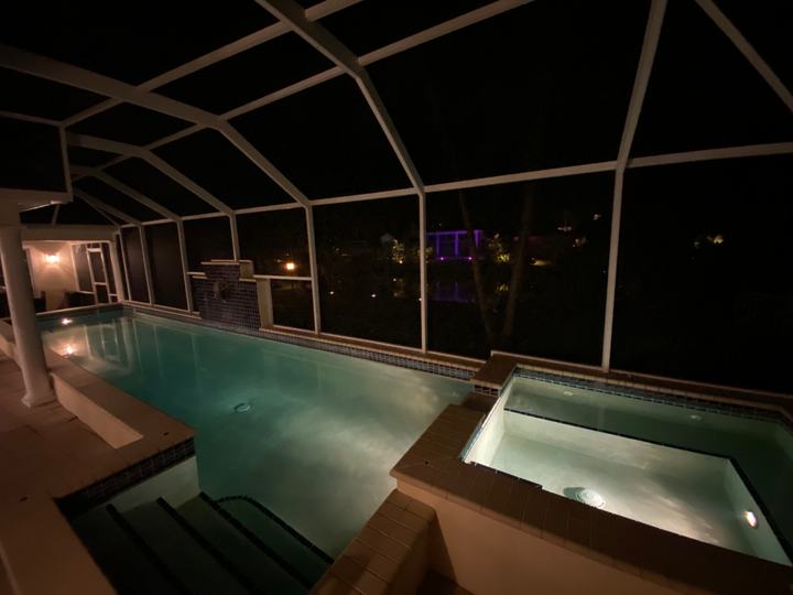 Pool and spa lit up at night