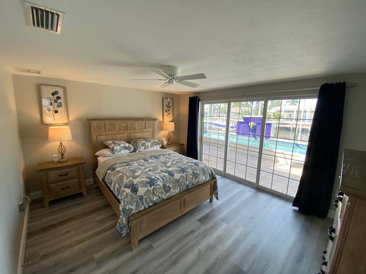 Guest bedroom with sliding doors to the pool