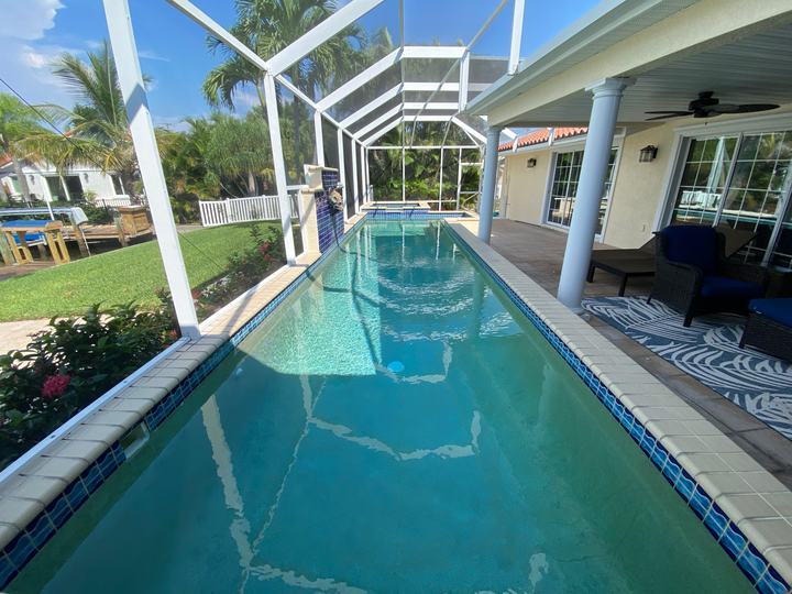 Heated pool under the screened lanai at Baker Bay